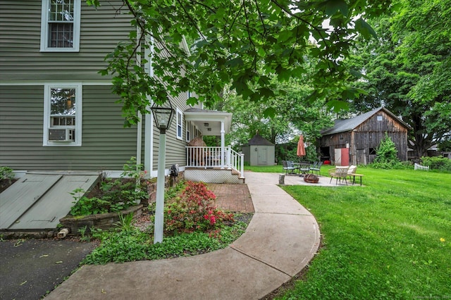 64 W St, Cromwell, CT 06416 - view of grassy yard with an outdoor fire pit