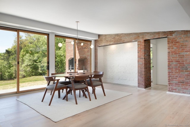 136 Belgo Rd, Salisbury, CT 06039 - dining space featuring brick wall, wood finished floors, and healthy amount of natural light