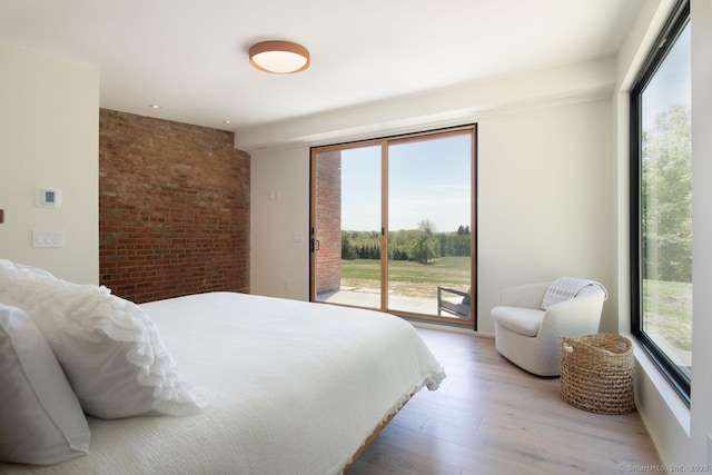 136 Belgo Rd, Salisbury, CT 06039 - bedroom with access to exterior, light wood-style flooring, brick wall, and recessed lighting