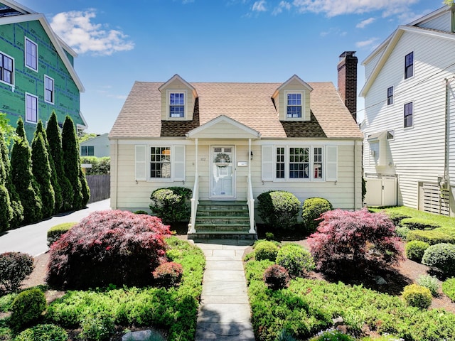 102 Pratt St, Fairfield, CT 06824 - cape cod home with roof with shingles and a chimney