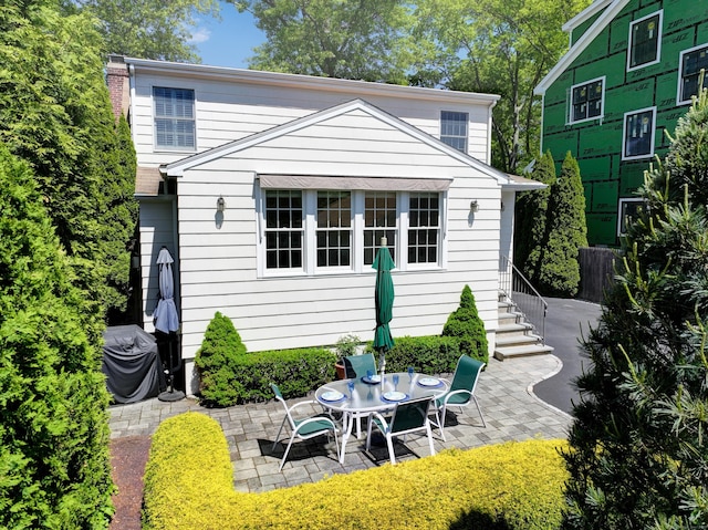 102 Pratt St, Fairfield, CT 06824 - rear view of house with a patio