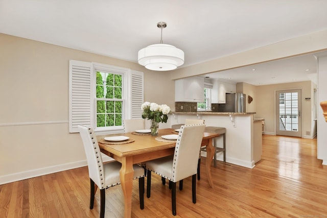 102 Pratt St, Fairfield, CT 06824 - dining space with light wood finished floors, baseboards, and plenty of natural light