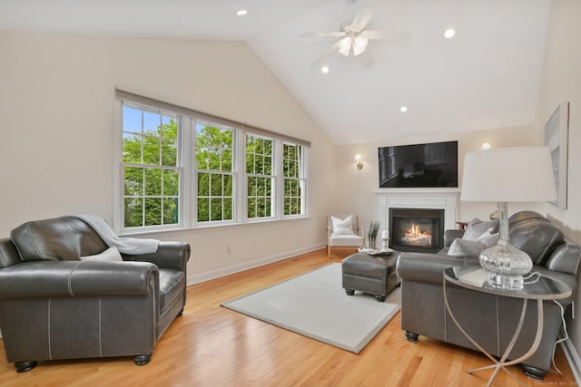 102 Pratt St, Fairfield, CT 06824 - living room featuring plenty of natural light, ceiling fan, a glass covered fireplace, wood finished floors, and recessed lighting