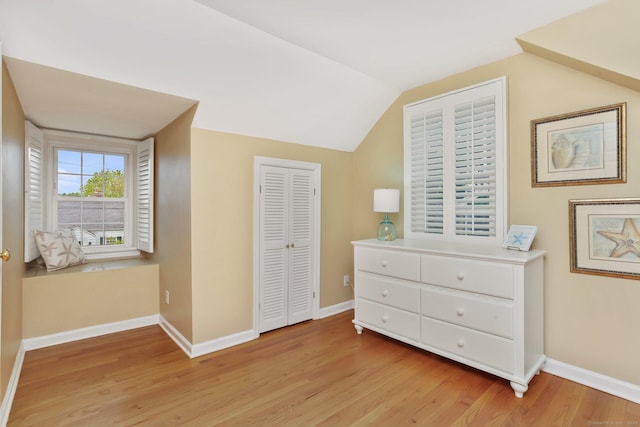 102 Pratt St, Fairfield, CT 06824 - bedroom with light wood-style floors, vaulted ceiling, baseboards, and a closet