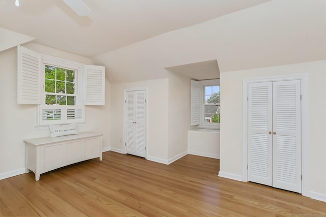 102 Pratt St, Fairfield, CT 06824 - additional living space with light wood-style flooring, baseboards, vaulted ceiling, and plenty of natural light