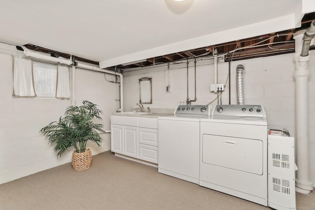 102 Pratt St, Fairfield, CT 06824 - laundry area featuring separate washer and dryer, cabinet space, concrete block wall, and light carpet