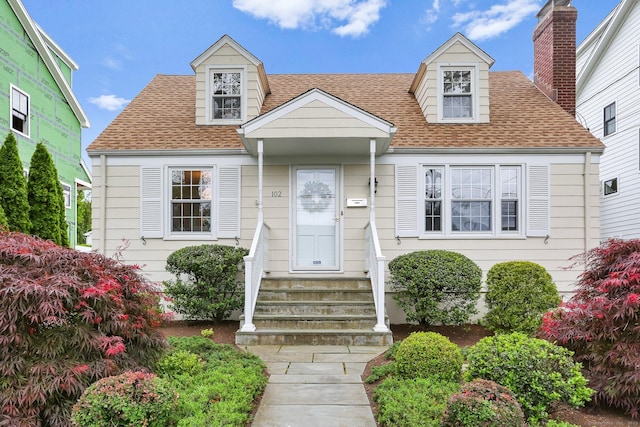 102 Pratt St, Fairfield, CT 06824 - new england style home featuring roof with shingles and entry steps