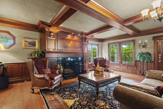 18 Ferry Rd, Old Lyme, CT 06371 - living room with beam ceiling, light wood finished floors, ornamental molding, a chandelier, and a premium fireplace