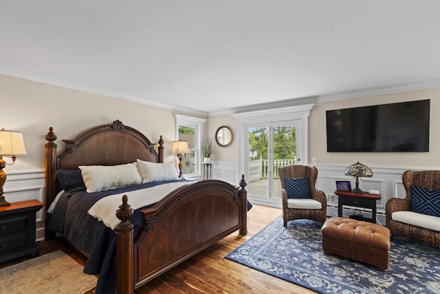 18 Ferry Rd, Old Lyme, CT 06371 - bedroom with access to outside, ornamental molding, a decorative wall, wood finished floors, and a wainscoted wall