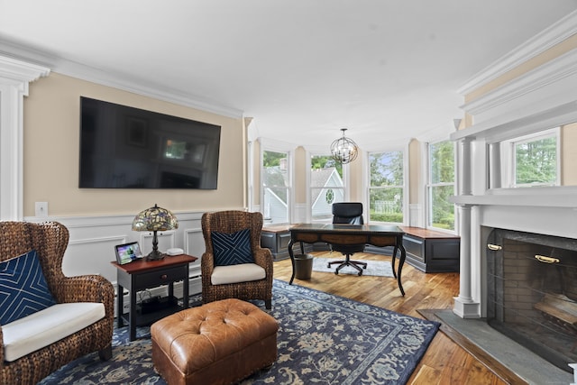 18 Ferry Rd, Old Lyme, CT 06371 - office featuring wood finished floors, crown molding, healthy amount of natural light, a fireplace with raised hearth, and a chandelier