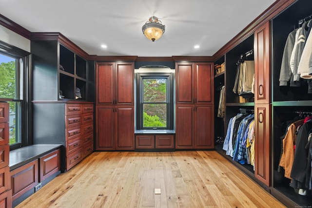 18 Ferry Rd, Old Lyme, CT 06371 - walk in closet featuring light wood-style flooring and arched walkways