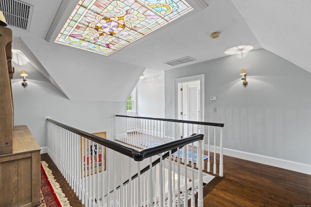 18 Ferry Rd, Old Lyme, CT 06371 - stairway with vaulted ceiling, wood finished floors, and baseboards