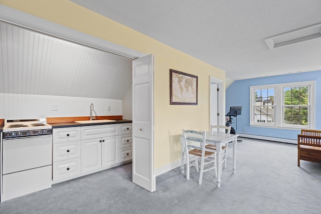 18 Ferry Rd, Old Lyme, CT 06371 - kitchen with electric stove, a sink, baseboard heating, light carpet, and white cabinets