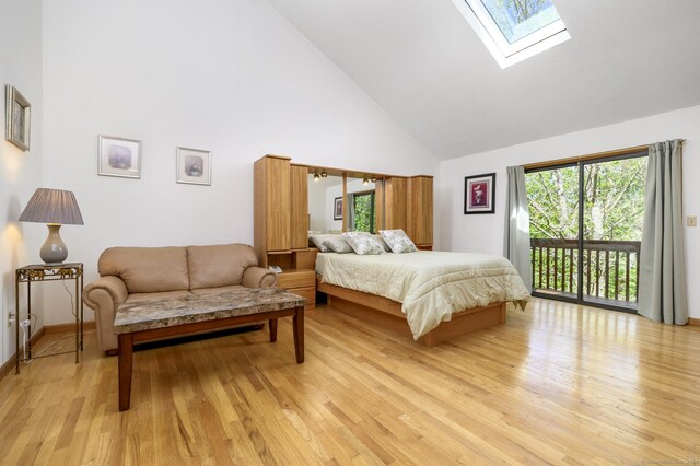 17 Walker Ln, Weston, CT 06883 - bedroom featuring high vaulted ceiling, access to exterior, a skylight, light wood-type flooring, and baseboards