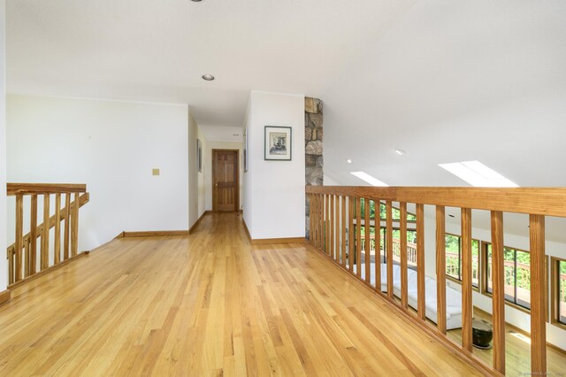 17 Walker Ln, Weston, CT 06883 - empty room with a skylight, wood finished floors, vaulted ceiling, baseboards, and recessed lighting