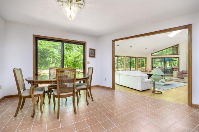 17 Walker Ln, Weston, CT 06883 - dining space featuring plenty of natural light, baseboards, vaulted ceiling, and light tile patterned floors