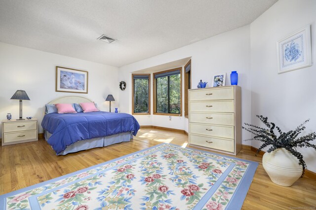 17 Walker Ln, Weston, CT 06883 - bedroom with light wood-style floors and baseboards