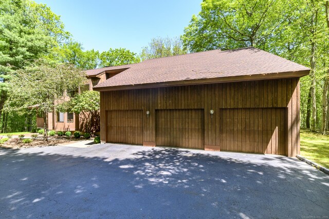 17 Walker Ln, Weston, CT 06883 - garage featuring asphalt driveway
