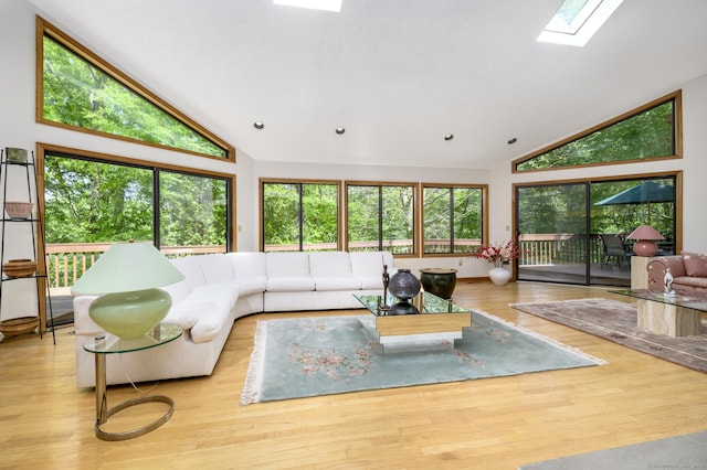 17 Walker Ln, Weston, CT 06883 - living area featuring wood finished floors, high vaulted ceiling, and a skylight