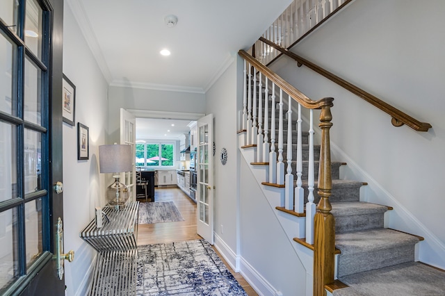 368 Nod Hill Rd, Wilton, CT 06897 - foyer entrance featuring french doors, wood finished floors, stairway, ornamental molding, and baseboards