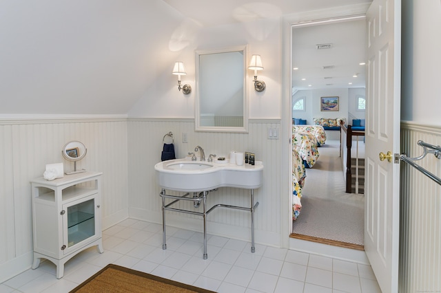 368 Nod Hill Rd, Wilton, CT 06897 - bathroom with wainscoting, tile patterned floors, a sink, and lofted ceiling