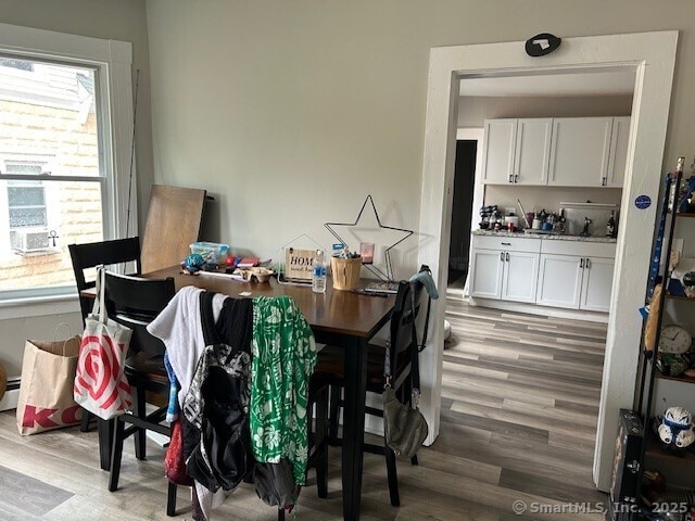 19 Wakefield Ct, New Britain, CT 06053 - dining space with wood finished floors and a baseboard radiator