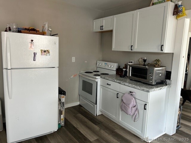 19 Wakefield Ct, New Britain, CT 06053 - kitchen featuring white appliances, dark wood-style floors, white cabinetry, and light stone counters