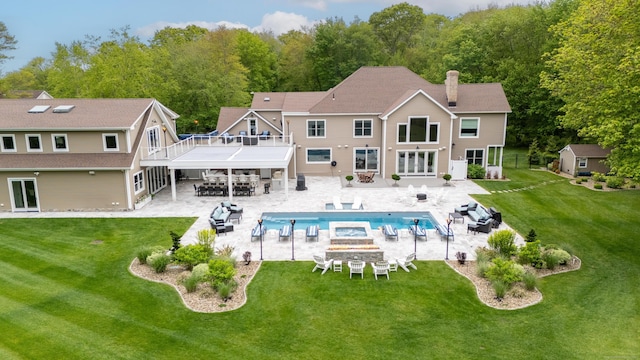15A Shore Rd, Waterford, CT 06385 - rear view of house with a fire pit, an outdoor pool, a yard, and a chimney