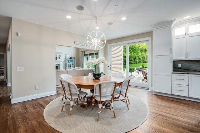 15A Shore Rd, Waterford, CT 06385 - dining room featuring a chandelier, wood finished floors, recessed lighting, and a fireplace