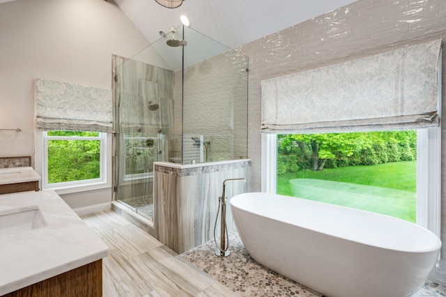 15A Shore Rd, Waterford, CT 06385 - bathroom with a stall shower, vanity, a freestanding bath, and vaulted ceiling