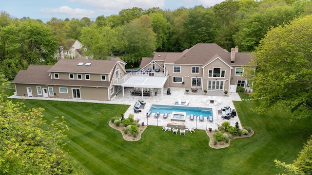 15A Shore Rd, Waterford, CT 06385 - rear view of house with a yard, a patio area, stairs, an outdoor pool, and an outdoor fire pit