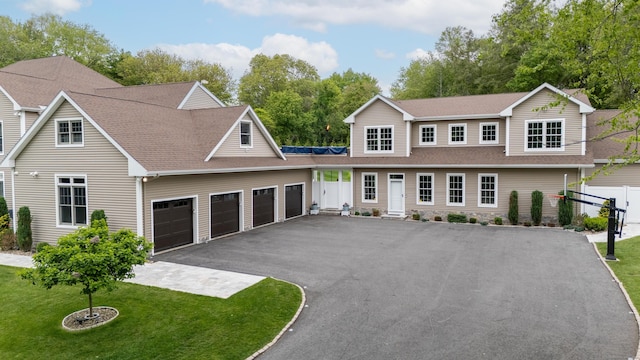 15A Shore Rd, Waterford, CT 06385 - traditional-style home featuring asphalt driveway, a garage, and roof with shingles