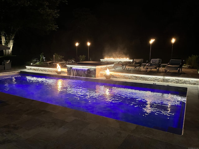 15A Shore Rd, Waterford, CT 06385 - pool at twilight featuring a patio, a fire pit, and an outdoor pool