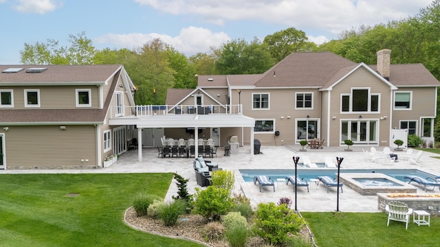 15A Shore Rd, Waterford, CT 06385 - rear view of property with a covered pool, a lawn, a fire pit, and outdoor dining area