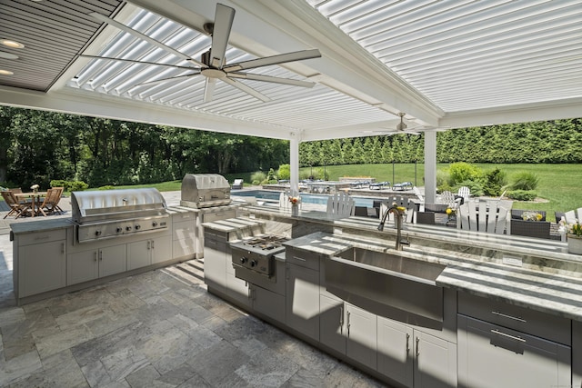 15A Shore Rd, Waterford, CT 06385 - view of patio / terrace with exterior kitchen and ceiling fan