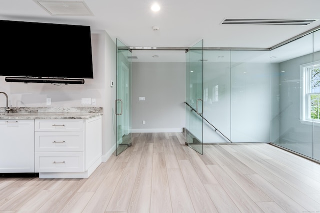 15A Shore Rd, Waterford, CT 06385 - bar area featuring light wood finished floors and baseboards