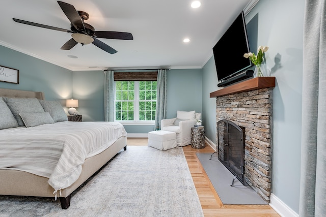 15A Shore Rd, Waterford, CT 06385 - bedroom with ornamental molding, light wood-style floors, a stone fireplace, ceiling fan, and recessed lighting