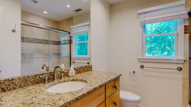23 Bartlett Mnr, Norwalk, CT 06850 - bathroom with toilet, tiled shower, vanity, and recessed lighting