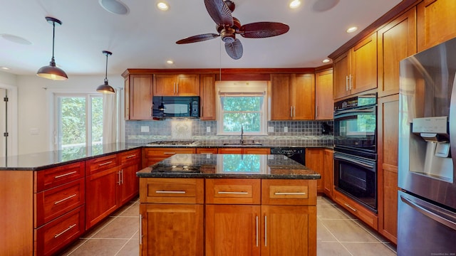 23 Bartlett Mnr, Norwalk, CT 06850 - kitchen featuring black appliances, decorative backsplash, a center island, light tile patterned floors, and recessed lighting