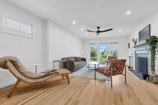 2 Quanaduck Cove Ct Unit 2, Stonington, CT 06378 - living room featuring light wood finished floors, a ceiling fan, ornamental molding, a fireplace, and recessed lighting