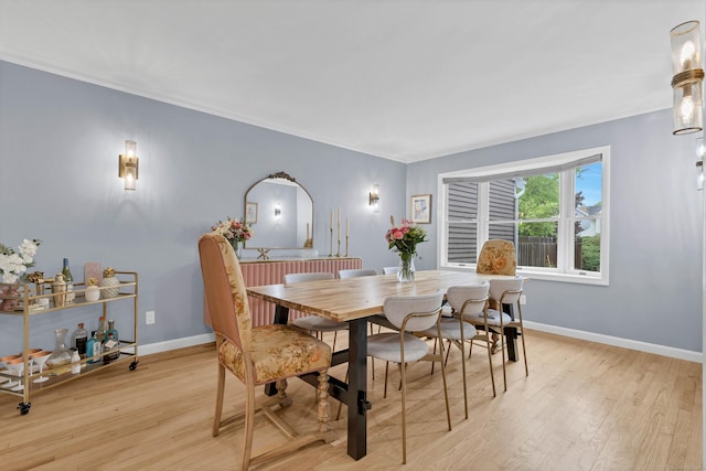 2 Quanaduck Cove Ct Unit 2, Stonington, CT 06378 - dining area with ornamental molding, light wood finished floors, and baseboards