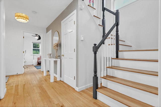2 Quanaduck Cove Ct Unit 2, Stonington, CT 06378 - foyer entrance featuring wood finished floors, stairs, and baseboards