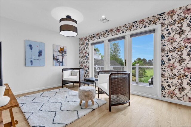 2 Quanaduck Cove Ct Unit 2, Stonington, CT 06378 - sitting room with baseboards, wood finished floors, and wallpapered walls