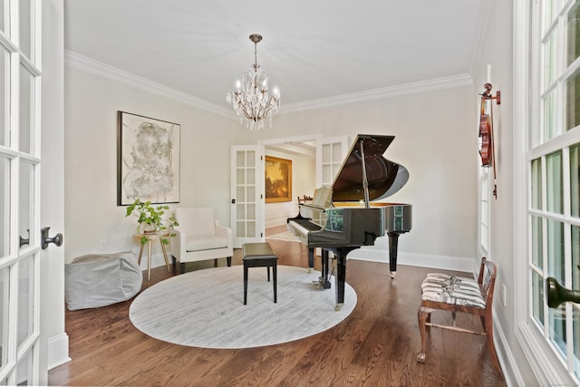 10 Easton Heights Ln, Easton, CT 06612 - sitting room with french doors, crown molding, wood finished floors, baseboards, and a chandelier
