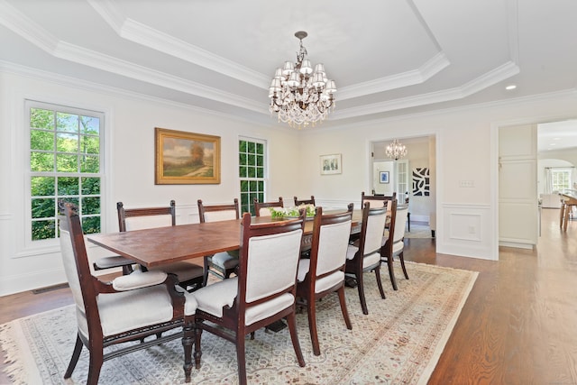 10 Easton Heights Ln, Easton, CT 06612 - dining area featuring a chandelier, plenty of natural light, wood finished floors, ornamental molding, and a decorative wall
