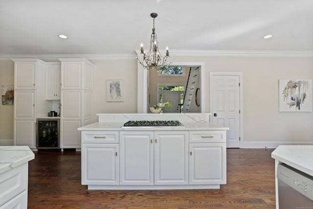 10 Easton Heights Ln, Easton, CT 06612 - kitchen with wine cooler, stainless steel dishwasher, gas cooktop, a chandelier, and ornamental molding
