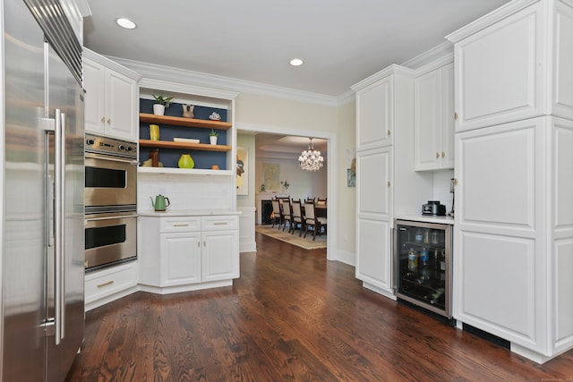 10 Easton Heights Ln, Easton, CT 06612 - kitchen featuring appliances with stainless steel finishes, wine cooler, open shelves, light countertops, and ornamental molding