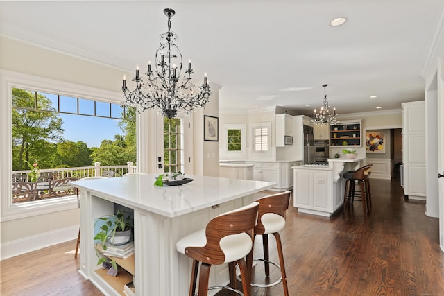 10 Easton Heights Ln, Easton, CT 06612 - kitchen featuring open shelves, a chandelier, a center island, a kitchen breakfast bar, and white cabinetry