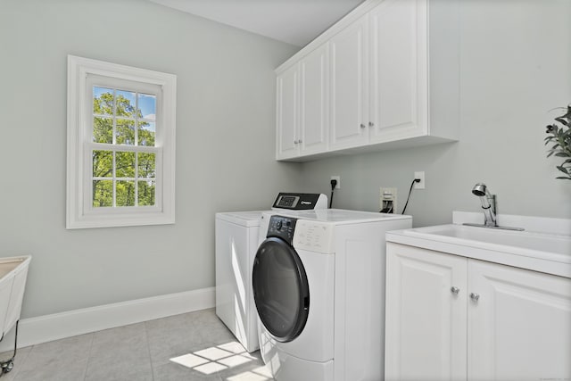10 Easton Heights Ln, Easton, CT 06612 - laundry area with cabinet space, washer and clothes dryer, baseboards, and light tile patterned floors