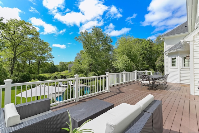 10 Easton Heights Ln, Easton, CT 06612 - wooden terrace featuring outdoor dining space, an outdoor hangout area, and view of scattered trees